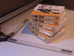 A stack of iText in Action books